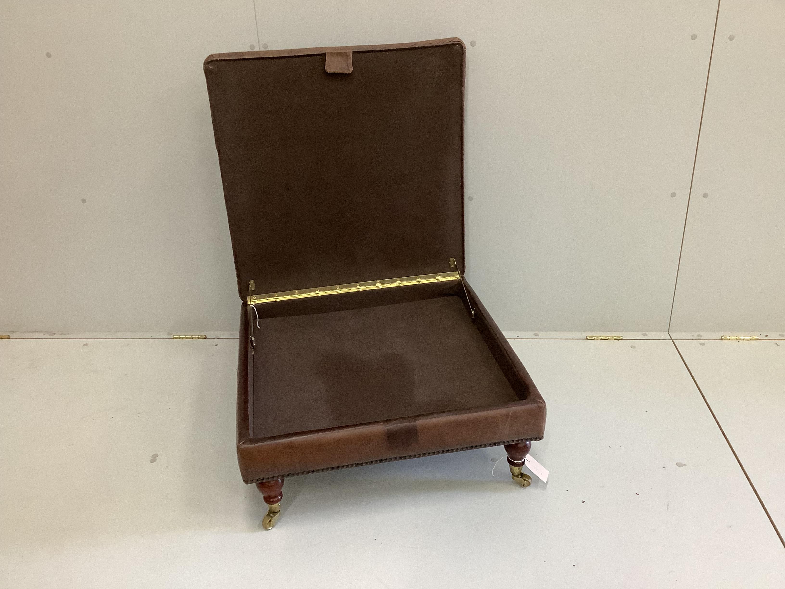 A contemporary brown leather hinged top square footstool, width 68cm, height 35cm